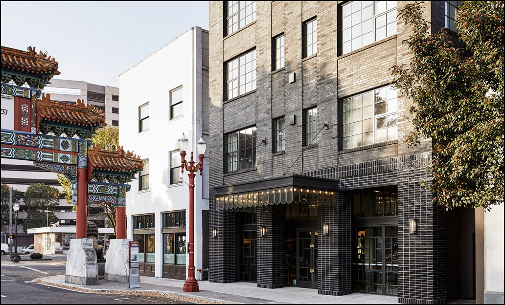 China town Deadstock location Modern building entrance with decorative archway on a city street